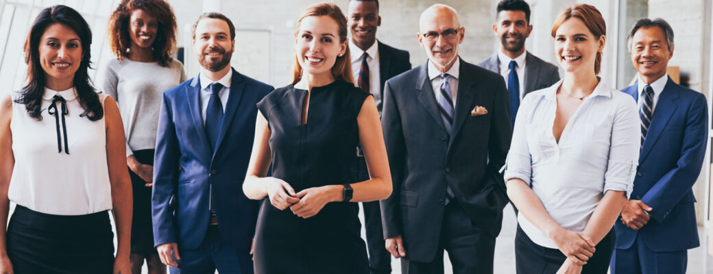 business men and women teaming up with big smiles