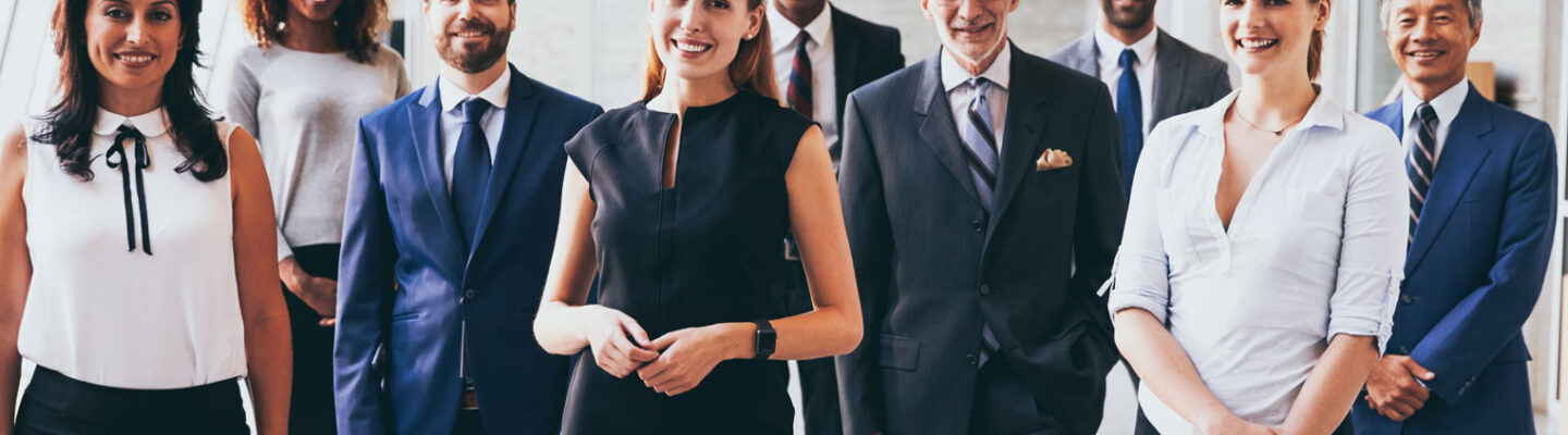 business men and women teaming up with big smiles